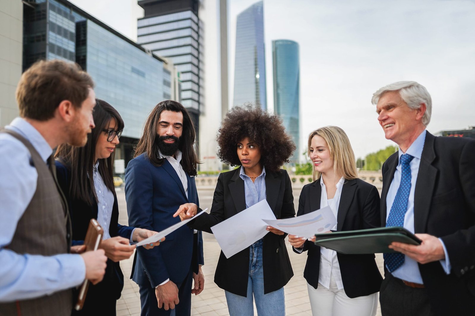 Multiracial business people working outdoor from office building – Focus on african woman face