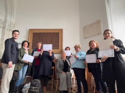 Participants Holding Energy Healing Their Certificates